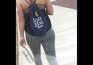 Sexy blonde teen in grey spandex on campus