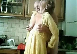 Mummy and daddy having fun in the kitchen. Stolen video
