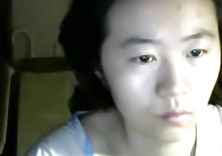 Plain looking Asian lady not shy to flash on cam