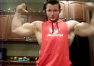 Bodybuilder posing in Kitchen