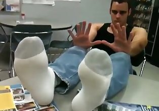 Justin shows US his feet at Work