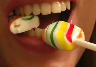Sucking and eating lollipop blonde