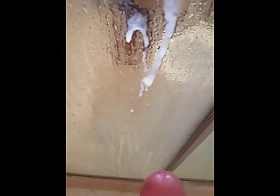 Cumming in the shower. Foreskin pulled back.